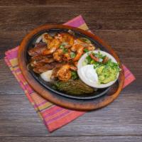 Fajita Plate Lunch Special · Only chicken. Served with charro beans, rice, salad, sour cream, guacamole and pico de gallo.