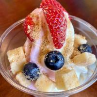 Strawberry Cheesecake · 9 oz. of swirled New York cheesecake and no-sugar added strawberry frozen yogurt topped with...