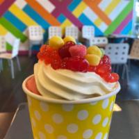 Child's Play · 9 oz. of cake batter frozen yogurt topped with strawberry popping boba, gummy bears, sour gu...