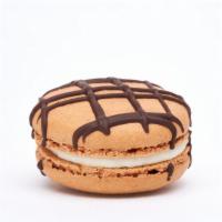S’mores Macaron · This macaron is graham cracker shell, marshmallow buttercream, dark chocolate