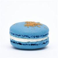 Blueberry Cheesecake Macaron · This macaron has a blueberry shells, cream cheese buttercream, graham cracker crumble