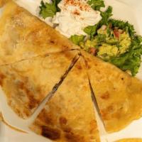 Quesadilla · 12” Flour tortilla filled with Monterey cheese, sautéed onions and mushrooms, and your choic...