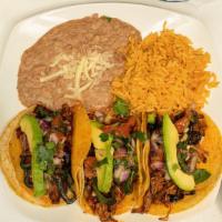 Tacos De Brisket · 3 corn tortillas filled with delicious slow-roasted Guajillo brisket meat and Monterey chees...