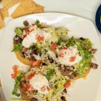Sopes · 3 deep dish corn masa lightly fried topped with beans, lettuce, tomato, sour cream, and ques...