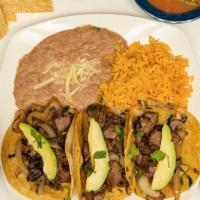 Street Tacos · 3 traditional street tacos with steak, sautéed onions, cilantro, and fresh avocado slices. S...