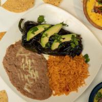 Grilled Poblano · Fresh-grilled poblano pepper stuffed with Monterey cheese and your choice of steak or chicke...