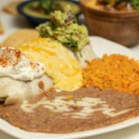 Burrito · Our 12-inch flour tortilla filled with beans, mixed cheese, and shredded chicken. Served and...