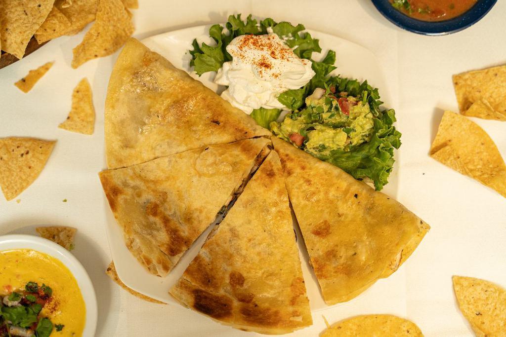 Quesadilla · Cheese quesadilla served with rice and beans.