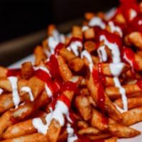 Mean Fries · Side of fries with our home made sauce on top.