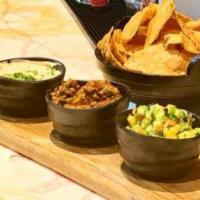 Fire Chips · Fresh made tortilla chips served with fusion dips (Includes Chicken dip).