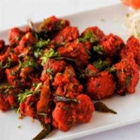 Chicken 65 -- An Indian delight · Boneless chunks of chicken marinated in ginger garlic and mild spices; then batter-fried and...