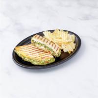 Chicken Pesto Panini · Grilled chicken, Parmigiana cheese, pesto sauce and fresh mozzarella. Served with chips and ...