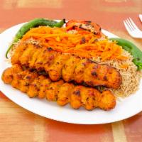 30. Chicken Adana Kebab · Ground chicken marinated with red bell peppers, paprika and garlic.