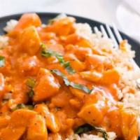 Chicken curry over rice · Choice of white or brown rice with optional veggies & lentil.