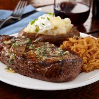 Shallot Butter Ribeye · A hand-cut 14 oz. ribeye topped with shallot and herb butter.  Served with choice of side an...