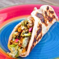 Chicken Kebab Roll · Pickled Onion, Bell Pepper, Lettuce, and Spiced Chicken Filling Wrapped in Buttery Indian Fl...