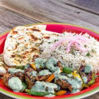 Chicken Kebab plate · Grilled skewered meat served with rice, naan, bell peppers, lettuce, pickled onions and mint...