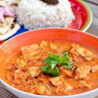 Tikka Masala · Roasted chicken pieces in thick curry sauce served with rice, naan and salad.