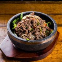 Bulgogi Over Rice · Steamed white rice topped with vegetables and thinly sliced
marinated beef rib-eye