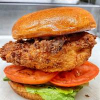 Fried Chicken Sandwich · Buttermilk fried chicken, lettuce, tomato and Mayo on a brioche bun. Served with fries 