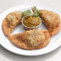 3 Empanadas · Chilean style empanadas stuffed with choice of ground beef or chicken, eggs, and raisins.