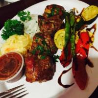 Lamb Kebab · Succulent lamb grilled on skewers, served with marinated onions and BRC sauce. Served with c...