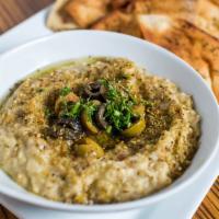 Hummus Dip · Chickpea-sesame dip, topped with olive oil and spices. Served with herbed pita chips