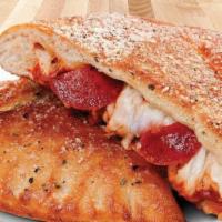 Pepperoni Calzone · A soft and chewy oven-baked pocket brushed with our signature sauce and stuffed with premium...