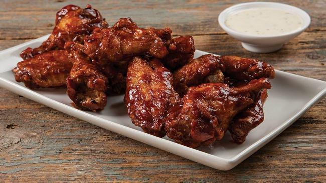 Bone in Wings · One pound of Bone-In Chicken Wings.  Crispy on the outside, plump and juicy on the inside. Our Wings are tossed in your favorite sauce and served with your choice of dipper.