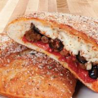 Classic Combo Calzone · A soft and chewy oven-baked pocket brushed with our signature sauce and stuffed with premium...