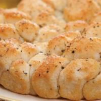 Italian Monkey Bread · Bite-size pieces of dough-oven baked to soft, chewy perfection, brushed with a garlic butter...