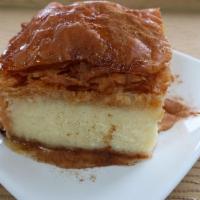 Galaktoboureko · Crispy phyllo dough layers filled with  flavorful and aromatic cream custard and soaked in h...