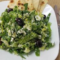 Prassini Salad · Green salad. Finely chopped ice berg lettuce tossed with dill, parsley, scallions, crumbled ...
