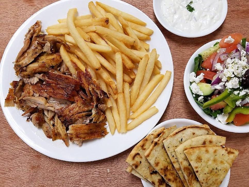 Chicken Gyro  Platter (shawarma) · Flavorful slow roasted chicken layers. Comes with tzatziki. Includes Greek salad, pita bread and your choice of rice, fries or lemon roasted potatoes.