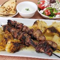 Souvlaki Pork Skewer Platter · 2 perfectly cooked juicy skewers. Comes with tzatziki. Includes Greek salad, pita bread and ...