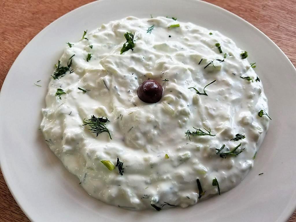 TZATZIKI · Refreshing Greek yogurt, cucumbers and garlic spread. Served with pita bread.
