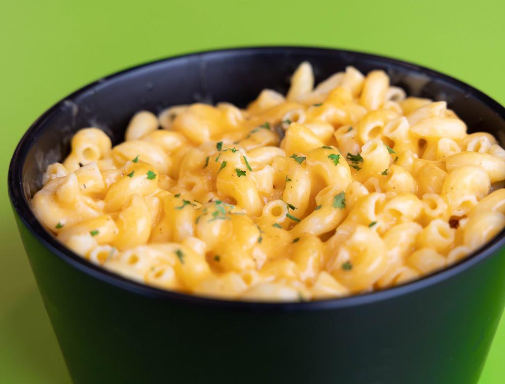 Macaroni and Cheese · In house made real cheddar cheese sauce mixed into gluten-free macaroni elbows.