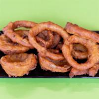 Onion Rings · Fresh cut onion rings dredged into seasoned flour, then dredged into an in house seasoned on...