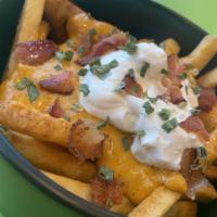 Loaded Fries · French fries, covered in our in-house made with 1/8 cup cheddar cheese sauce, 1/8 cup sour c...