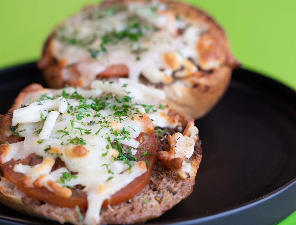 Bruschetta Bread · Gluten-free bun, covered with balsamic vinegar, oil seasonings, tomato, Parmigiana Reggiano cheese, and mozzarella cheese baked until crispy. Add balsamic vinegar for an extra charge.
