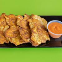 Tostones · Plantain discs. Fried green plantains, pressed into small discs, then refried, almost like a...