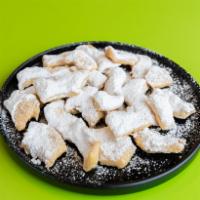 Fried Dough · Fried dough covered in your choice of sugar, powdered sugar, or cinnamon.
