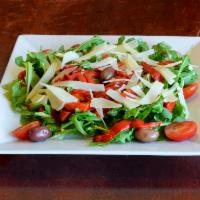 Arugula Salad · Fresh arugula, black olives,fire roasted red peppers and shredded parmagiano reggiano tossed...