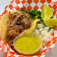 Carnitas Taco · Served with cilantro, onions and salsa.