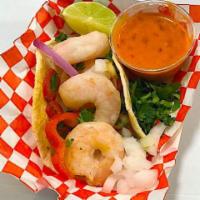 Shrimp Tacos  · Served with large shrimp, garlic, butter, green pepper, chili pepper and sauce 