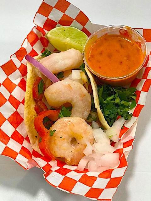 Shrimp Tacos  · Served with large shrimp, garlic, butter, green pepper, chili pepper and sauce 