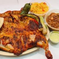 Grilled  Chicken · Whole chicken grilled on mesquite charquel. Served with 12  oz of rice,        12 onz of bea...