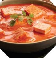 Tomato Creamy Soup · Smooth soup with pureed tomatoes and seasoning.