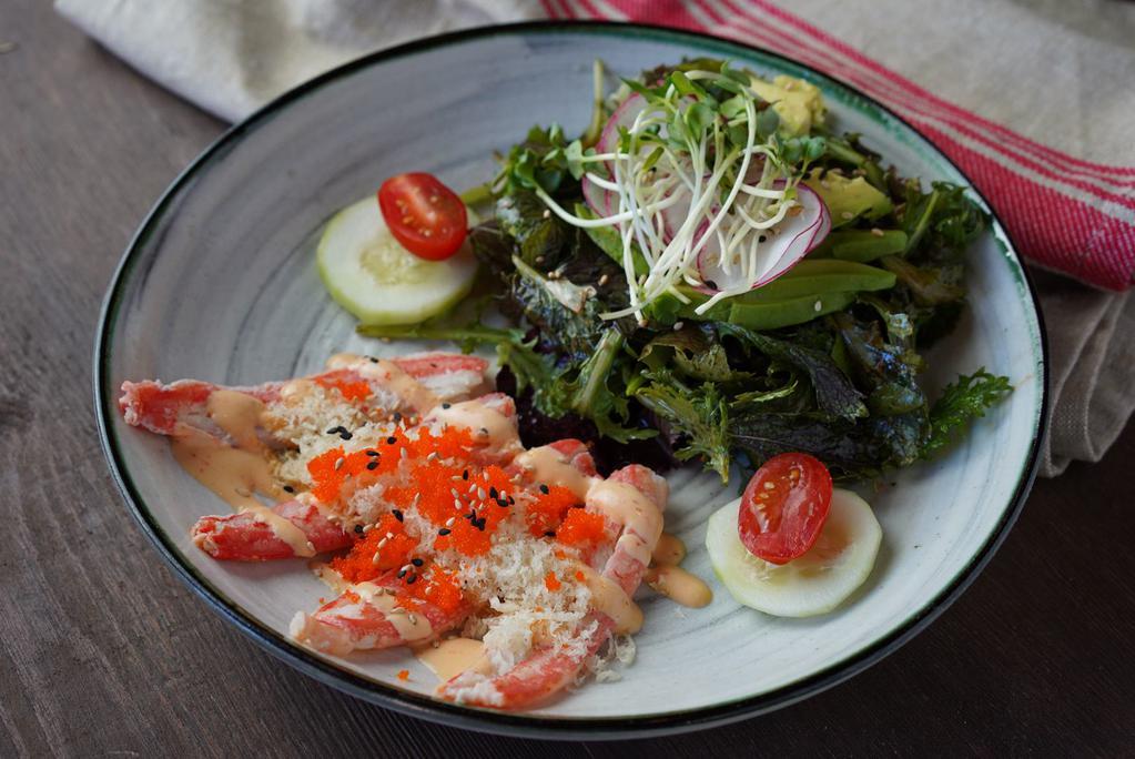 Snow Crab Salad · Spring mix salad with snow crab, cucumber, tobiko and crunch with spicy mayo.