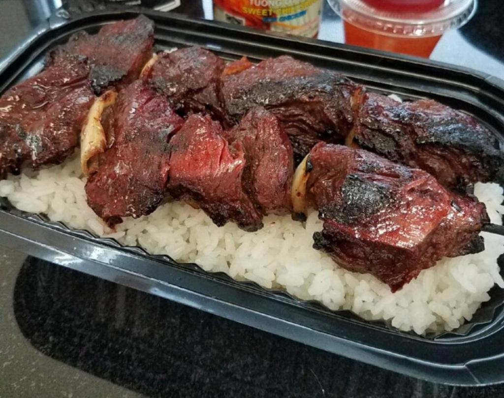 Korean BBQ Beef Bento DOUBLE · Daily cut and marinated hanger steak and onion skewers atop a perfectly steamed bed of Japanese white or brown rice. Your choice of sauce.